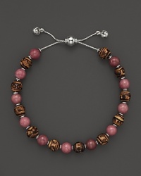 Bamboo and rhodonite beads make a vibrant pairing on this timeless Gucci bracelet.