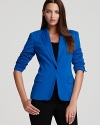 A vibrant palette accentuates the structured silhouette of a VINCE CAMUTO blazer for a bold, bright approach to your 9-to-5. Style with a colored pencil skirt and stop traffic from commute to corner office.