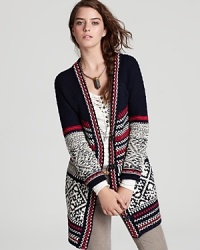 Embrace the cooler weather in this cozy-chic Free People sweater--this long cardigan, enriched by a classic fairisle print, arrives right on course for fall in an inviting wool blend.