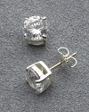 Carolee dazzling round cubic zirconia stud earrings set in sterling silver. Gold post backing. 7mm.