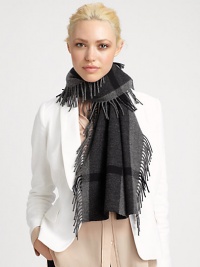 A large check pattern and fringed edges embellish this ultra-soft, woven wool and cashmere wrap.Wool/Cashmere18 X 61Dry cleanImported