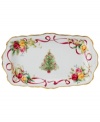 Royal Albert offers a festive twist on a favorite pattern, mixing Christmas trees, holly and bows with pink and gold blooms on the Old Country Roses Holiday tray. Gold-banded porcelain coordinates flawlessly with the original dinnerware collection.