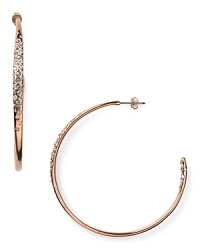 Alexis Bittar's rose gold-plated hoops are a striking example of the label's contemporary edge. With a fluid shape and crystal detailing, these earrings are style-setting final touch.