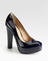 Sultry patent leather platform with an ultra-high heel. Self-covered heel, 5 (125mm)Covered platform, 1 (25mm)Compares to a 4 heel (100mm)Patent leather upperLeather liningRubber solePadded insoleImported