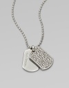 Glittering pavé: stones set in an edgy dog tag pendant on a ball chain. Cubic zirconia and glass stonesSilvertone metalLength, about 18Pendant size, about .75Toggle closure with logo charmImported 