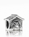 A cute canine reposes in a sterling silver and enamel doghouse. Charm by PANDORA.