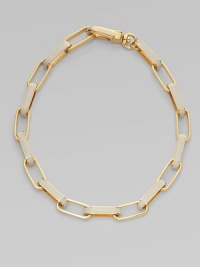 A chunky, statement piece with wide, enamal accented links. Plated brassEnamelLength, about 18¾Large lobster clasp closureImported 