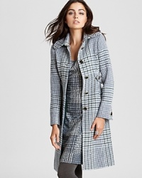 Striking a balance between masculine and feminine, a Tory Burch coat flaunts a menswear-inspired silhouette emboldened by an chic plaid print.