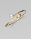 Brushed 18k yellow gold, luminous diamonds, and an iridescent pearl richly combine to create this artistic, elegant design.Diamonds, 0.06 tcw Freshwater pearl 18k yellow gold Diameter, about 2½ Made in Italy