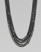 From the Blackened Chain Collection. This beautiful, multi-row design is embellished with faceted garnet, hematite and 18k gold station beads. Garnet, hematite and 18k gold beadsBlacked sterling silverLength, about 16½ to 18½ adjustableToggle closureImported 