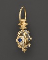 An 18K yellow gold evil eye amulet, set with diamonds and sapphires, frames a crystal. By Temple St. Clair.