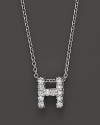 From the Tiny Treasures collection, a diamond H necklace. With signature ruby accent. Designed by Roberto Coin.