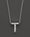 From the Tiny Treasures collection, a diamond T necklace. With signature ruby accent. Designed by Roberto Coin.