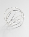 From the Alliance Collection. A sleek tube of sterling silver crisscrosses the wrist in this alluringly simple design by Allan Scharff.Sterling silverDiameter, about 3Width, about 3Imported