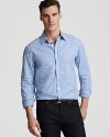 In a timeless check print, Michael Kors' slim-fitting sport shirt lends a tailored yet laid-back look.