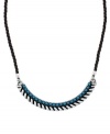 A touch of turquoise adds a fresh feel to this Jessica Simpson necklace. A black rope is adorned with a silver tone mixed metal setting and plastic turquoise beading. Approximate length: 16 inches.