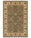 Covered in graceful floral imagery, this area rug will fill your room with color. The Sedona Henna rug is woven from New Zealand worsted wool that has been specially twisted and space-dyed to replicate the look of a hand-woven Peshawar rug. In limestone green with accents of red and beige, this magnificent piece creates an inviting space for gatherings in your home.