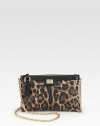 A bold leopard-print characterizes this mini crossbody with a gleaming chain strap. Chain shoulder strap, 50 dropTop zip closureOne inside open pocketFully lined8W X 5H X 1DMade in Italy