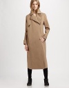 Modernized by an asymmetrical zipper, this military-inspired trenchcoat has notched lapels, slash pockets and a back vent for mobility. Notched lapelsButton frontAsymmetrical zipperLong sleeves with buttoned cuffsSlash pocketsButtoned back belt; back ventAbout 36 from shoulder to hemCottonDry cleanMade in ItalyModel shown is 5'10 (177cm) wearing US size 2.