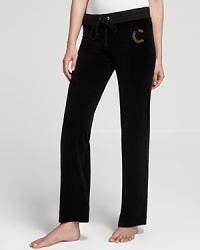 Rhinestone embellishment glams up your classic Juicy Couture velour pants for a luxe approach to laidback style.