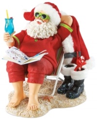 Off-duty Santa! After delivering all those gifts, the big guy deserves to sit back and relax. Sitting on a beach chair with a drink in hand, Santa unwinds and lets his toes run through the sand.