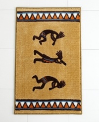 Revered by Native Americans, Kokopelli gives your bathroom an authentically Southwestern vibe. A colorful diamond pattern frames the dancing deity on this sand-colored bath rug.