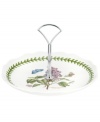 Lifelike lilacs and Portmeirion's triple-leaf border grace this daintily scalloped server, a must-have for the Botanic Garden dinnerware collector. With silvertone metal handle.