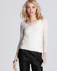 Tonal dots and silver beads add texture and style to this ethereal-looking Free People sweater, rendered in a lush wool blend.