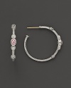 Faceted, oval-shaped pink crystals, flanked by hearts, bring romantic glamour to classic sterling silver hoop earrings.