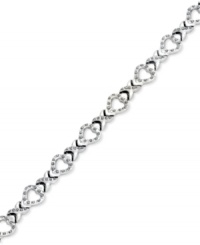 An excellent selection. This X link bracelet is crafted from platinum over sterling silver with diamond accents giving it a lustrous touch. Approximate length: 7-1/2 inches. Approximate width: 3/8 inch.