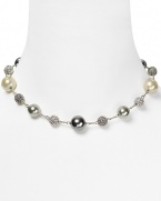 Embellished with delicate pearl and crystal stations, Carolee's illusion necklace sparkles with versatility -- elegant whether worn to dress up denim or enliven a classic white blouse.