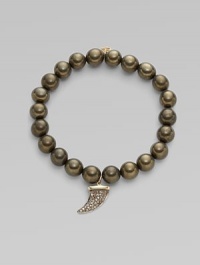 This pyrite beaded, stretch design is accented with a diamond embellished 14k gold and rhodium horn charm for a modern look. Pyrite beads14K goldDiamonds, .22 tcwLength, about 6¾Elastic slip-on styleMade in USA of imported materials