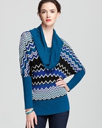 The cool blues and greens in Karen Karen's patterned sweater pair perfectly with your denim collection.