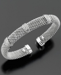 Part of the stylish Dewdrop collection, this diamond bracelet features round-cut diamond (1/3 ct. t.w.) set in sterling silver. Stretches to fit wrist. Approximate diameter: 2-1/4 inches.