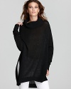 A loose-fitting Rachel Zoe turtleneck is cut in an oversized silhouette with high vents at the side, perfect for layering over skinny jeans and go-anywhere leggings.