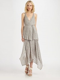 Tonal striped highlight this airy jersey knit crafted with a tiered handkerchief hem.V necklineSleevelessWrap-around beltTiered hemRacerbackAbout 43 from natural waist55% rayon/45% spandexDry cleanMade in USAOUR FIT MODEL RECOMMENDS ordering true size. 