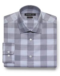 The oversized check print of this handsome dress shirt offers you an off-the-beaten-path pattern that differentiates your look in and outside the office. A fine ground for a colorful tie as well, rendered in classic cotton.