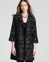 Classic jacquard goes contemporary chic as blurred brushstrokes shake up a sharply-tailored Eileen Fisher coat.