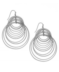 Spiral style. INC International Concepts comes full circle with this pair of hook earrings. Crafted from silver-tone mixed metal, the earrings offer a post-modern fashion touch. Approximate drop: 2-1/2 inches.