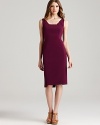 In a rich jewel-tone hue, Elie Tahari's plum-colored sheath dress boasts fashion-forward details like an asymmetric hem and pop-of-color contrasts.