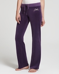 Embrace decadent dressing in plush Juicy Couture velour pants, embellished with gleaming typography for shameless diva appeal.