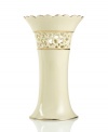 Distinguished by a scalloped edge, bands of gold and heart cutouts in creamy ivory porcelain, the lovely vase combines traditional style and timeless grace.