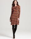 With a nod to the ‘70s, a bold retro plaid and flawless tie neckline lend timeless sophistication to this RAOUL dress.