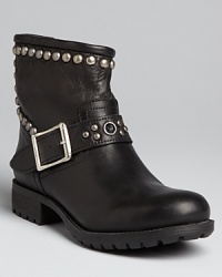 Tough moto attitude is stylishly softened up with rounded studs in these mild-meets-wild Kelsi Dagger booties.