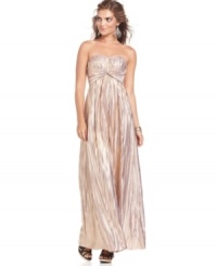 Tiny pleats amplify the metallic shimmer of Jessica Simpson's latest gown and a twist of fabric just below the bust makes the silhouette super flattering!