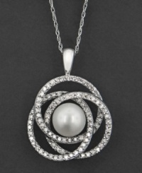 A soothing pattern of interlocking sparkling circles makes an eye-catching backdrop for a beautiful cultured freshwater pearl (7 mm). This pendant features round-cut diamonds (1/2 ct. t.w.) set in 14k white gold. Approximate length: 18 inches. Approximate drop: 1-1/4 inches.