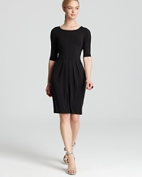 The cornerstone to any 9-to-5 uniform, this black Karen Kane dress flaunts a pleated skirt for a flattering, feminine silhouette. Team with strappy sandals and sleek accents for style that works overtime.