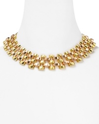 This Michael Kors necklace refines the (be) deck, cast in two tone plated metal with a bold, open link design.