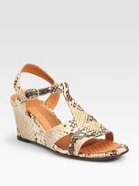 Snake-print leather t-strap with a chunky wedge and an adjustable ankle strap. Self-covered wedge, 3 (75mm)Snake-print leather upperLeather liningRubber and leather solePadded insoleImportedOUR FIT MODEL RECOMMENDS ordering one half size up as this style runs small. 