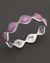 Bright purple enamel drops over a carved sterling silver bangle By Elizabeth Showers.